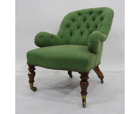 Small Victorian salon chair in cream button-back upholstery, turned front legs terminating in brass caps and castors, stamped