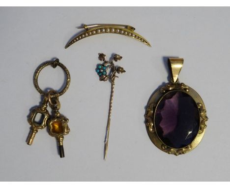 Gilt metal and pale amethyst coloured stone pendant, two&nbsp;ornate watch keys, a gold coloured metal and turquoise stick pi