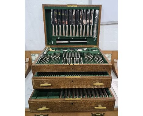 Silver plate canteen , Dixon and Co. rattail, twelve settings, within fitted wooden canteen with two drawers below, missing o