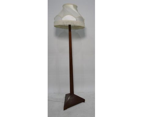 20th century mahogany standard lamp, the column of triangular cross-sectional form on triangular feet