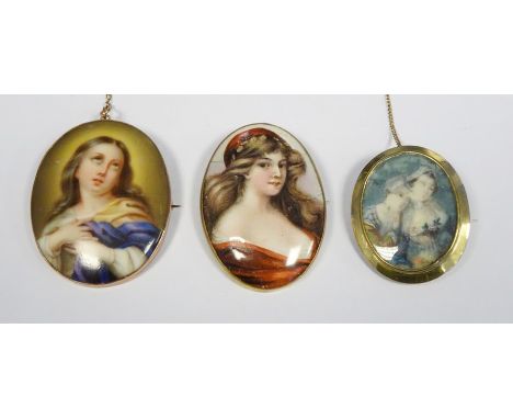 Gold-coloured oval brooch with painted scene of half-length portrait of two ladies and two other gold-coloured oval brooches 