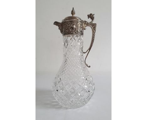 LATE 20TH CENTURY silver-mounted cut glass claret jug, London with pinecone finial, mask spout and mythical beast scroll hand