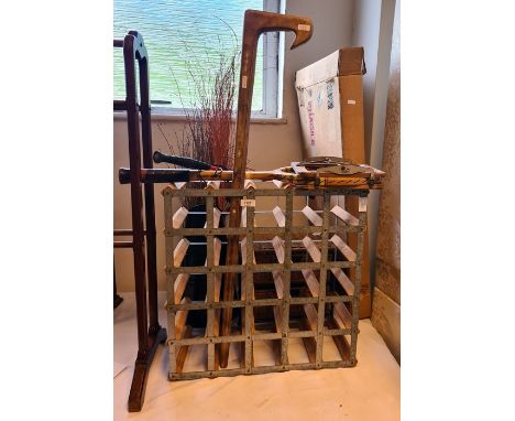 Wine rack, riding crop, a vintage tennis racket, etc.