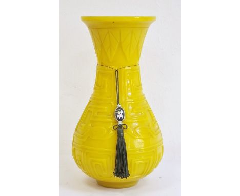 Chinese carved yellow Beijing glass vase, of baluster form with everted neck, carved with key pattern, stylised insects and s
