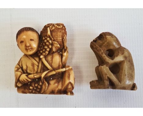 Late 19th century Japanese ivory carved netsuke modelled as a seated man holding a basket of fruiting vine, 4cm high and a ca