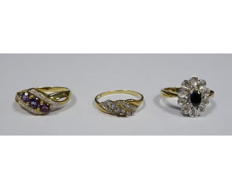 9ct gold, diamond and amethyst-coloured stone dress ring set three amethyst-coloured stones with bands of diamonds, a 9ct gol