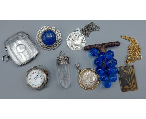 A Birmingham silver vesta case by William Hair Haseler, with engine turned decoration together with a silver cased watch four