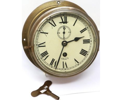 Henry Browne &amp; Son LTD brass marine clock with key, working at lotting. P&amp;P Group 2 (£18+VAT for the first lot and £3