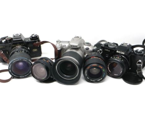 Three SLR camera bodies with lenses, including Nikon, Zeiss and Ricoh, shutters all working. P&amp;P Group 2 (£18+VAT for the