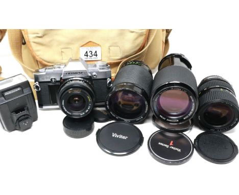 Olympus OM-30 photographic outfit with mixed lenses. P&amp;P Group 2 (£18+VAT for the first lot and £3+VAT for subsequent lot