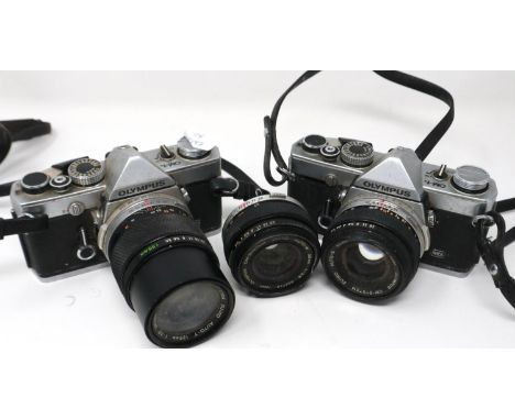 Two Olympus OM-1 SLR cameras with lenses. P&amp;P Group 1 (£14+VAT for the first lot and £1+VAT for subsequent lots) 