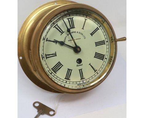 Smiths astral brass marine clock with key, working at lotting. P&amp;P Group 2 (£18+VAT for the first lot and £3+VAT for subs