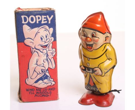 Scarce Wells  Clockwork Tinplate ‘Dopey’ made in Great Britain by permission Walt Disney Mickey Mouse Ltd, orange/yellow/red 