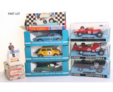 Scalextric cars, accessories and track, C.053 Datsun 260Z blue, C.007 Mini-Cooper yellow, C.051 B.R.M P.160 racing car, all i