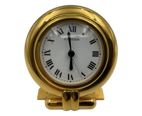 Cartier, Pasha de Cartier desk/travel clock, of circular form with gilt finish and white dial, with quartz movement, inscribe