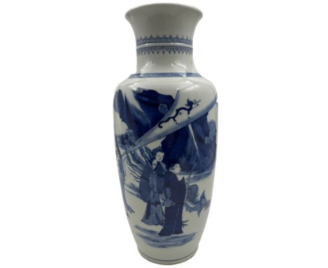 A Chinese blue and white Qing dynasty style vase, painted in underglaze blue with figures in a rocky landscape, six character