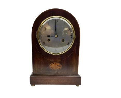 Edwardian - German 8-day mahogany mantle clock with a round top and satinwood inlay to the front, on a shallow base raised on