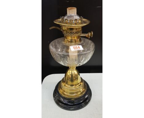 An Edwardian brass and glass oil lamp: no shade or chimney, 40cm in height. 