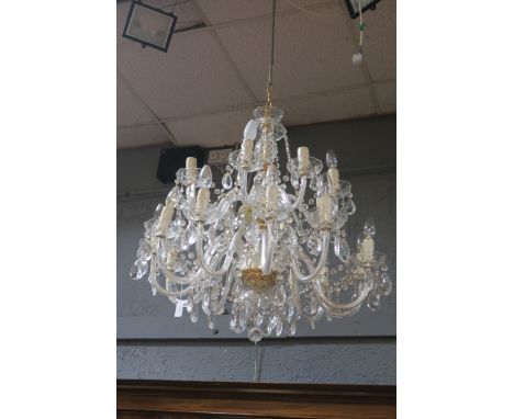 A FINE CUT GLASS TWENTY BRANCH CHANDELIER, hung with fastnet chains and pendent drops THE BUYER OF THIS LOT WILL BE GIVEN THE