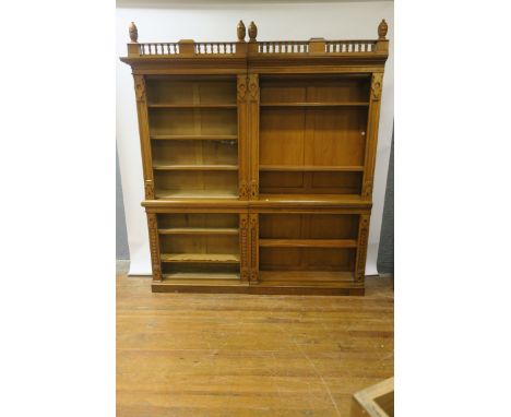 A GOOD PAIR OF OAK GOTHIC REVIVAL BOOKCASES,c.1880 the later openwork bobbin turned cornice headed by oval reeded finials abo