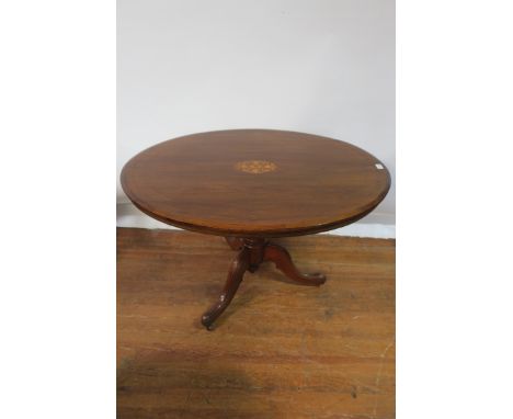 A VICTORIAN ROSEWOOD AND MARQUETRY INLAID SUPPER TABLE the oval top centred by a foliate filled motif with satinwood string i