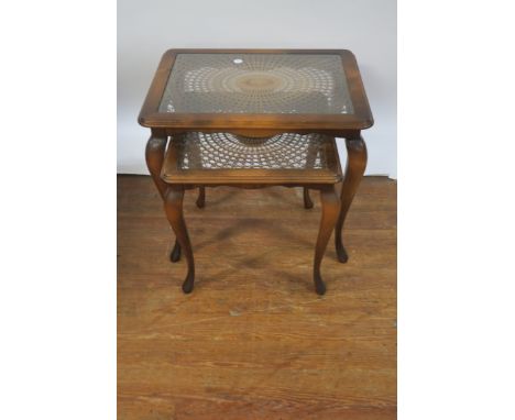 A MAHOGANY NEST OF TWO TABLES,  20th CENTURY, the rectangular tops with cane work panel and glazed inserts moulded rim on cab