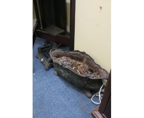 A CAST IRON FOOT SCRAPE, together with a cast iron planter, (2).