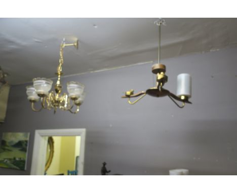 A BRASS FOUR BRANCH CENTRE LIGHT, with frosted glass shades, together with a retro three branch centre light.