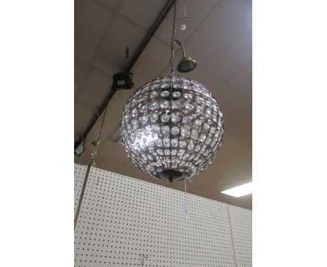 A CONTINENTAL WIRE MESH & CUT GLASS CENTRE LIGHT, decorated with fastnet pendents