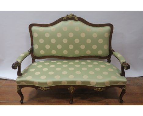 A CONTINENTAL ROSEWOOD VENEERED SOFA the rectangular shaped back with gilt brass foliate mounts and outset upholstered green 