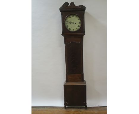 A MAHOGANY LONGCASE CLOCK, the swan neck pediment centred by a raised foliate, with circular white enamelled dial with black 