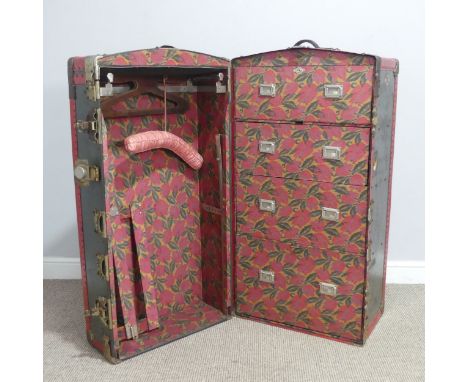 An early 20th century metal bound steamer Wardrobe Trunk, the&nbsp;trunk with brass locks and leather handles enclosing fully