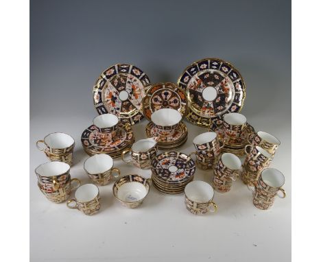 A Royal Crown Derby Imari pattern 2451 tea service, of lobed form, comprising six cups and six saucers, cream jug and sugar b