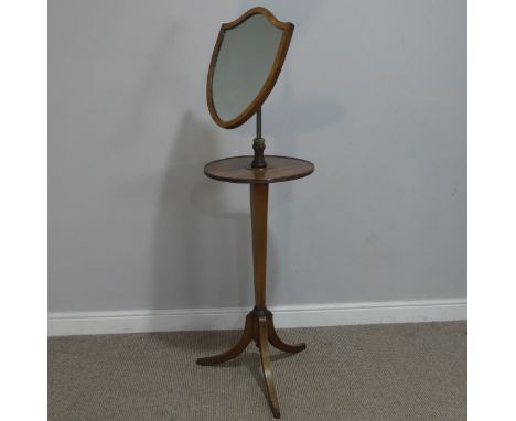 A Georgian mahogany Shaving Stand, the shield swing mirror on telescopic stand, raised on tripod table, W 45 cm x H 145 cm x 