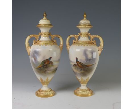 A pair of Royal Worcester twin-handled Vases and covers, painted with Pheasants in naturalistic and misty landscapes, both si