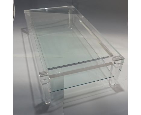 An Italian Lucite and glass topped coffee Table, c.1970, by Fabian Art, Rome, with glass shelf under tier and label, W 150.5 