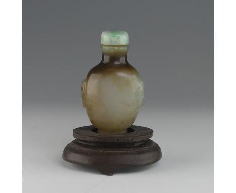 A Chinese jade Snuff Bottle, flanked with mask handles, with associated jade stopper, H 5.8cm