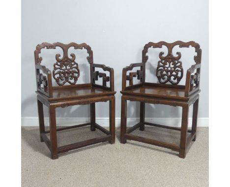 A pair of late 19th/early 20th century Chinese carved hardwood Armchairs,&nbsp;with scrolled top rails above a pierced decora