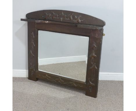 In the manner of Liberty &amp; Co a large Arts and Crafts copper framed overmantel Mirror,&nbsp;possibly by J &amp; F Pool of