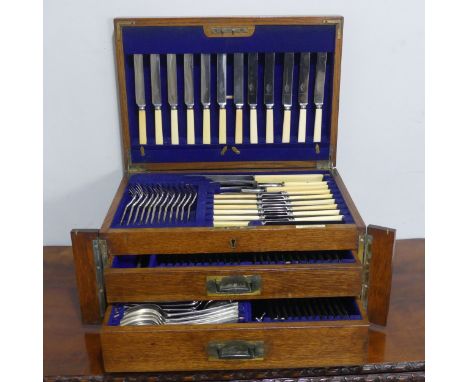 A canteen of Mappin &amp; Webb silver plated Cutlery, with brass campaign inset handles, twelve place setting, with ivorine l