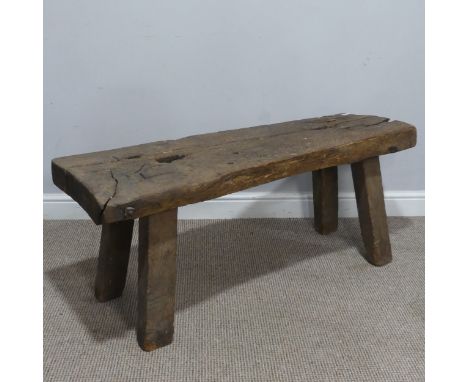 An antique rustic oak Bench, of joint construction, W 115 cm x H 48 cm x D 39 cm.
