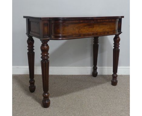 An unusual William IV mahogany bow-front cutlery/side Table, the hinged top with reeded frieze and a concealed button lock me