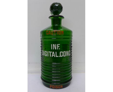 A 19th Century large emerald green glass Digitalis Patent poison flask with enamel lettering, (rare colour)