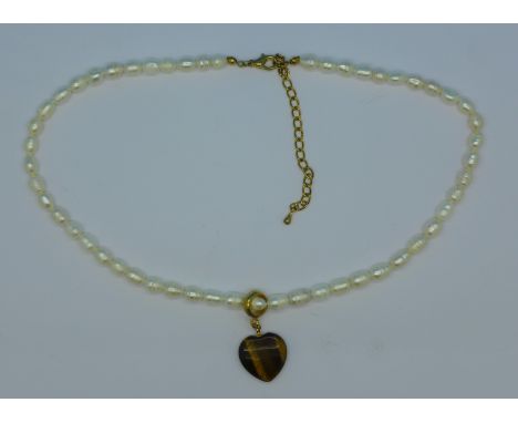 A pearl and tigers eye necklace