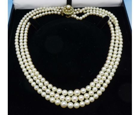 A triple row cultured pearl necklace with 9ct gold clasp