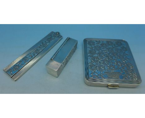 An 835 silver set comprising compact, lipstick with flip open mirror and comb case, c.1930's