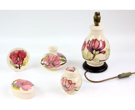 Group of Moorcroft pottery decorated in the 'Pink Magnolia' pattern on an ivory ground, comprising a squat baluster vase, gin