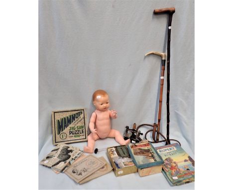 A SMALL JAPANNED VINTAGE TOY SEWING MACHINE with other items, including a collection of cigarette cards, a mammoth jigsaw puz