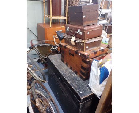 A LARGE WOODEN TRUNK with two wooden boxes and two suitcases
