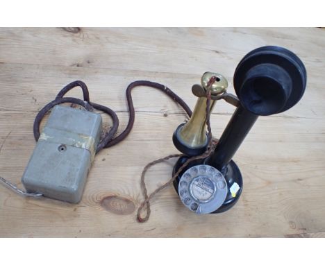 A VINTAGE BRASS AND JAPANNED 'CANDLESTICK' TELEPHONE 
